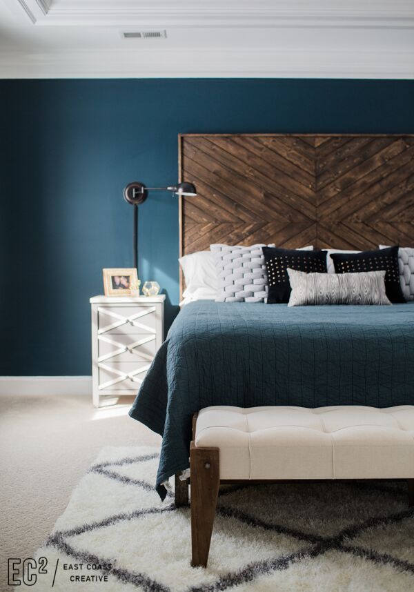 Bedroom with stunning blue accent wall.